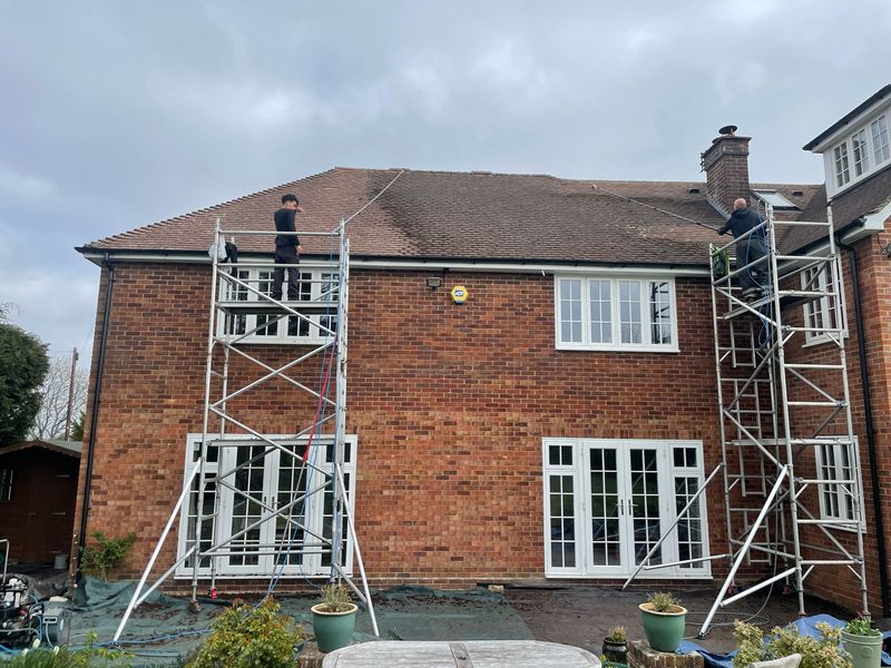 Roof cleaning carried out safely from scaffold towers by The Roof Moss Cleaners in Benson